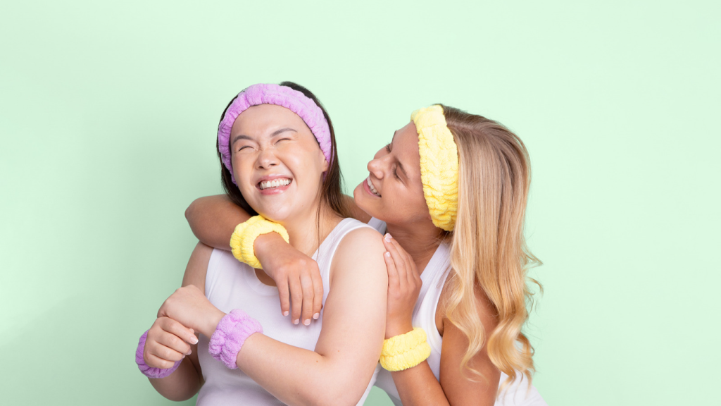 Spa headbands and wrist towels on two girls