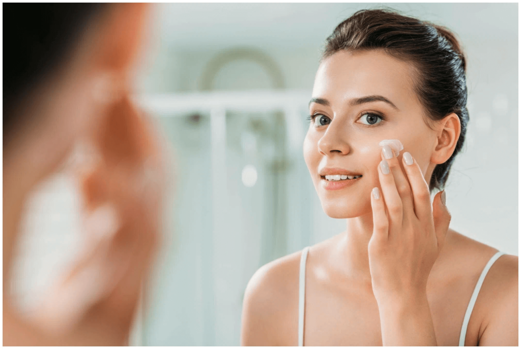 Women washing face with face cleanser
